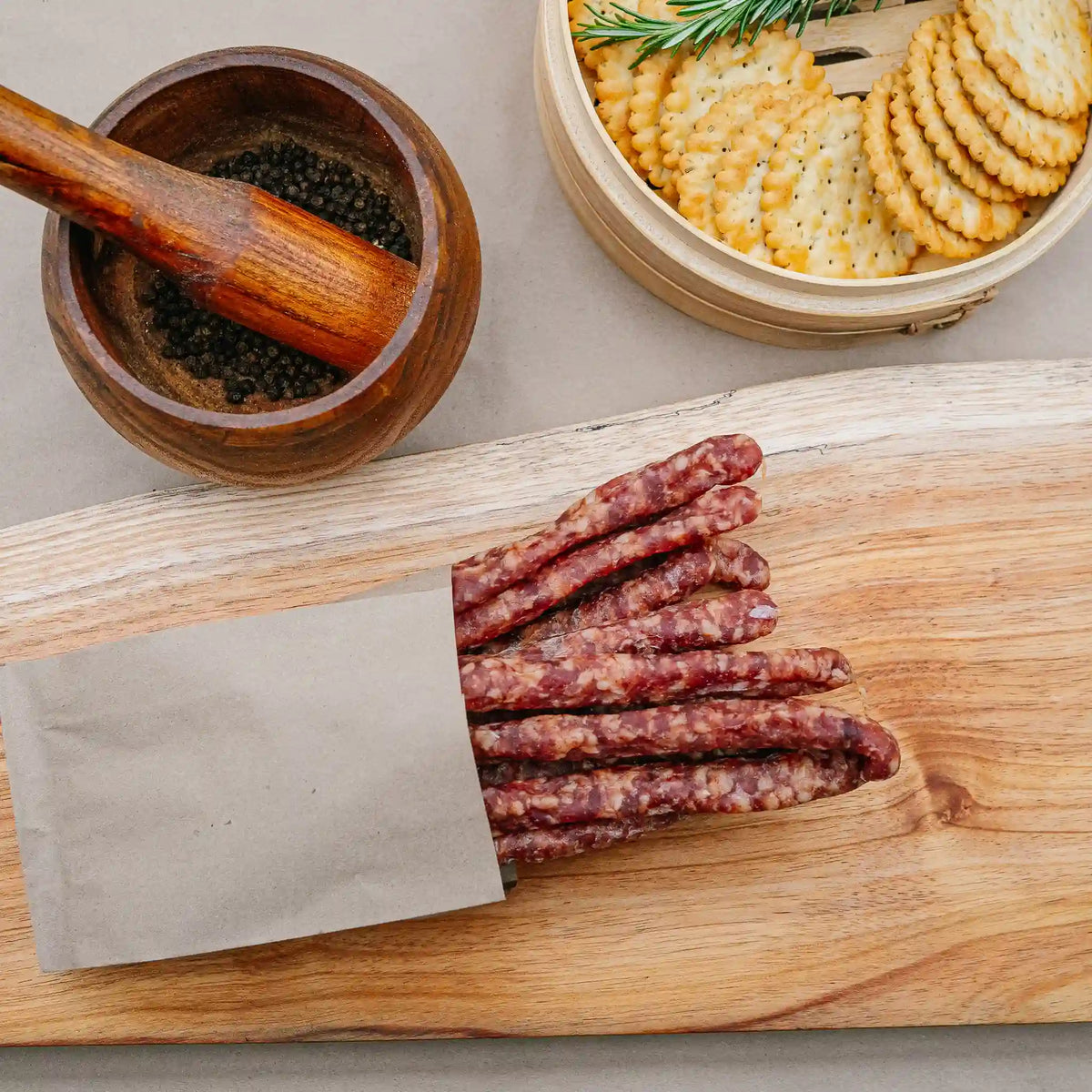 Cabanossi sausage sticks from Greeff's Butchery, Knysna, on a wooden board.